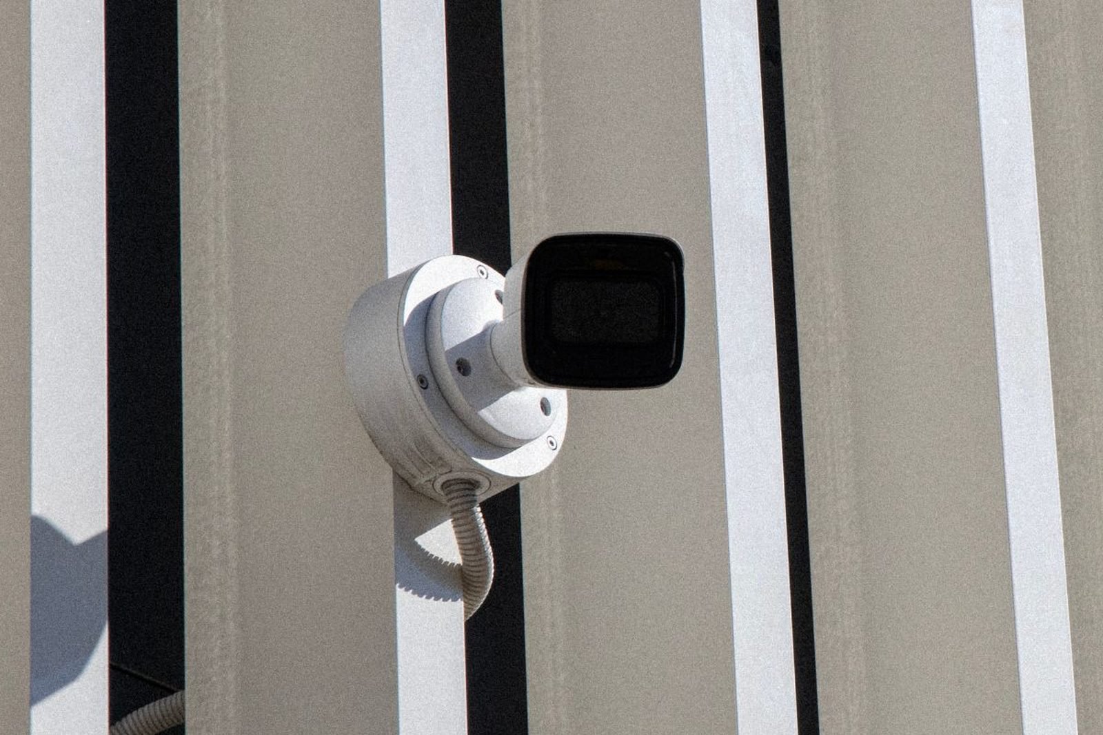 Security camera mounted on a building exterior