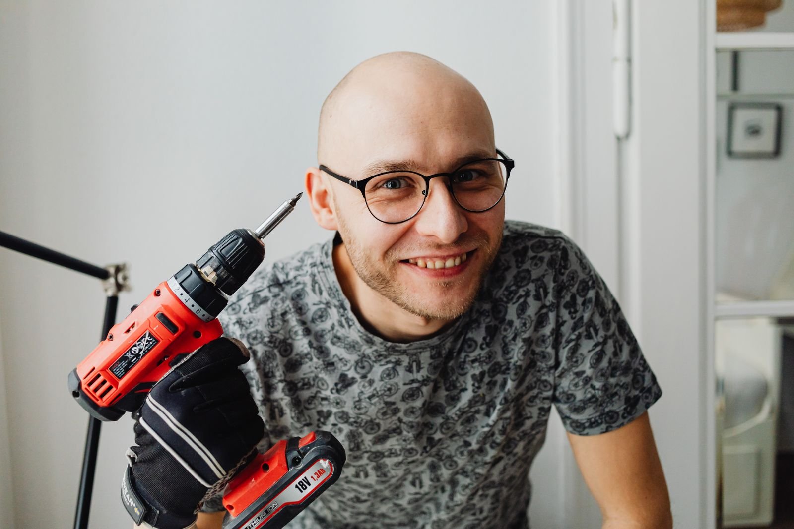 Handyman with a power drill on a home repair visit