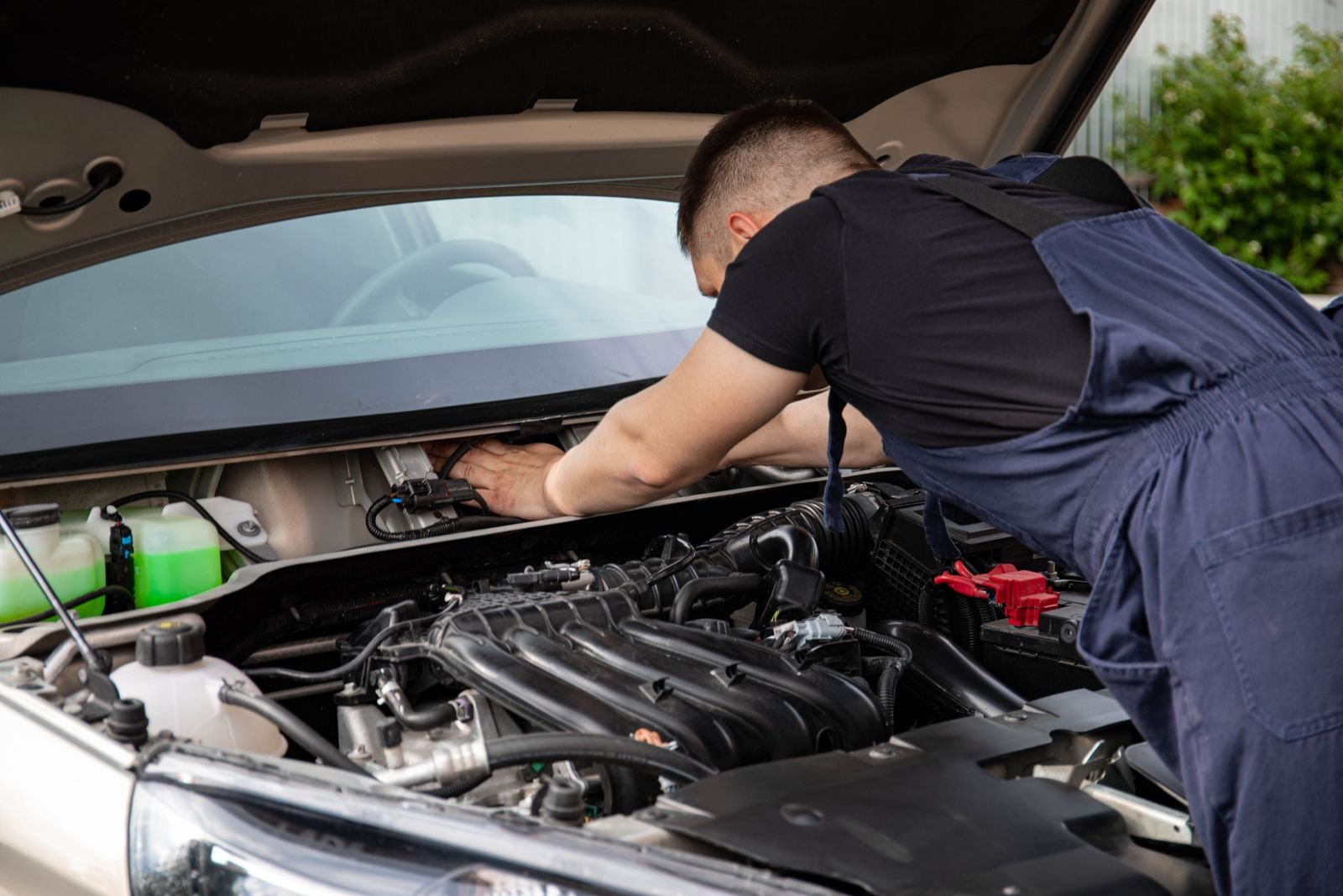 Mechanic carrying out engine maintenance